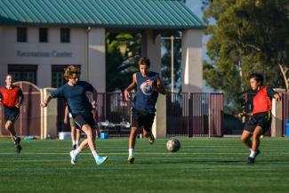 Students playing intramural soccer.